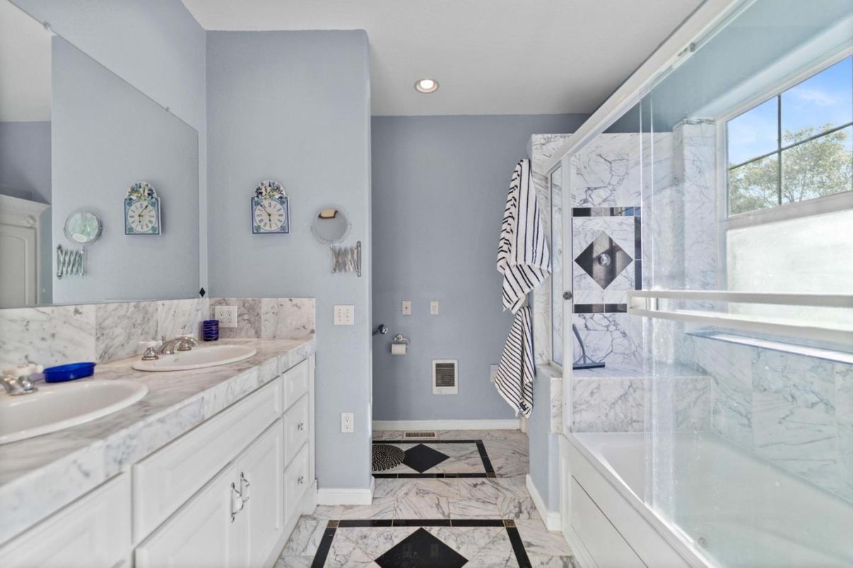 Bathroom, Dual Sink Vanities, Glass Shower, Interior, Marble, Marble Walls, Recessed Lighting