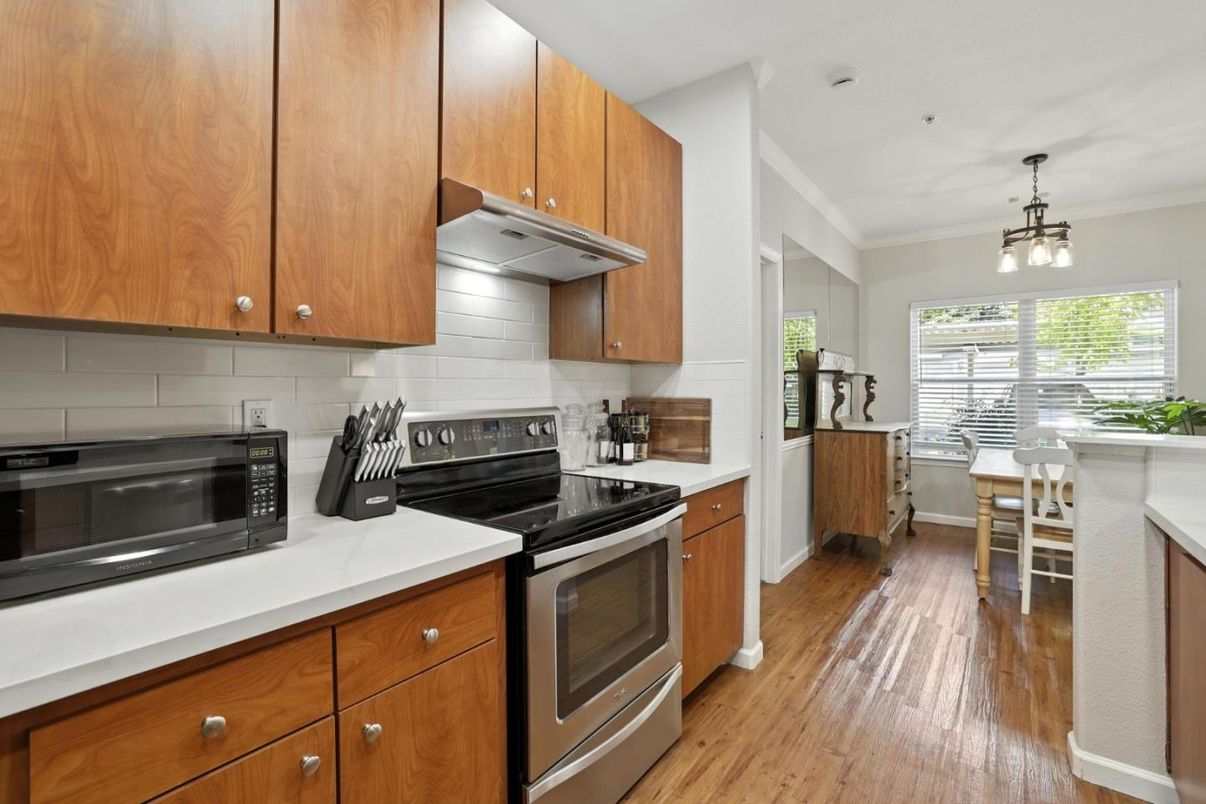 Dining room, Interior, Kitchen, Pendant Lights, Stainless Steel Appliances, Wood Texture Flooring