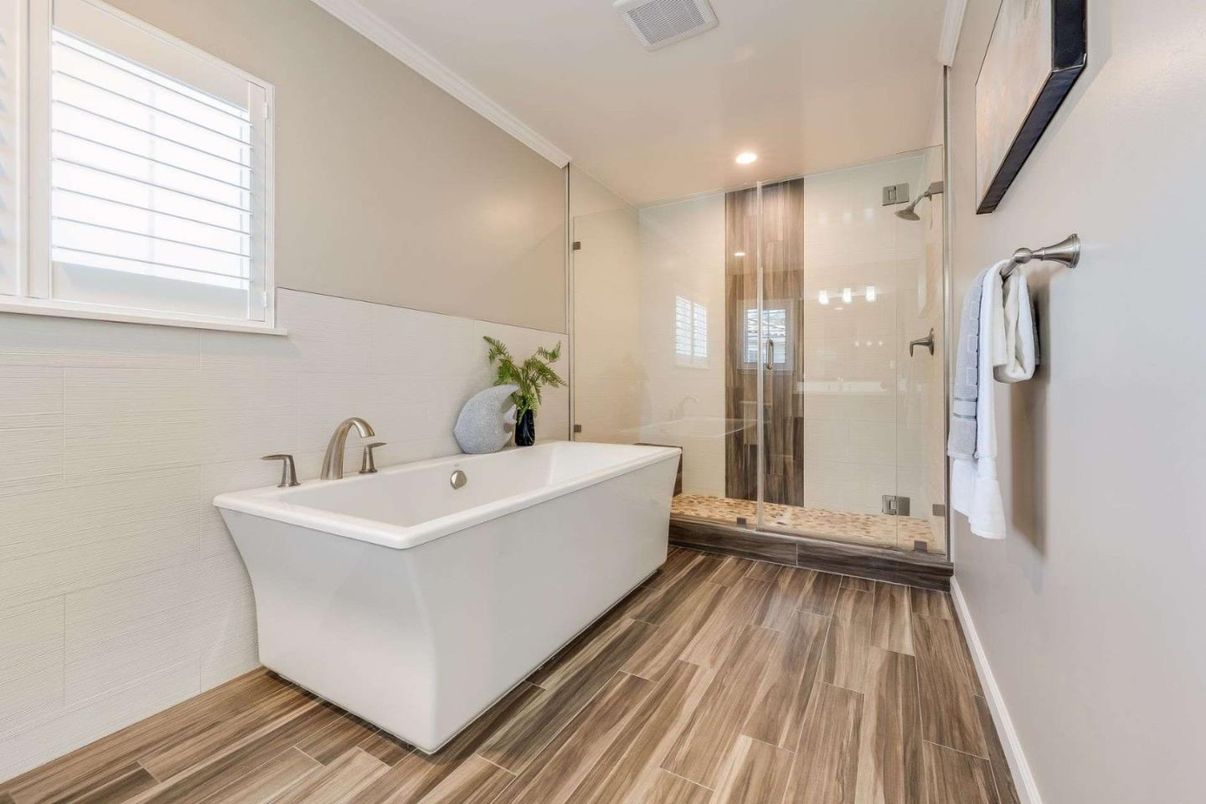 Bathroom, Free Standing Baths, Glass Shower, Interior, Recessed Lighting, Wood Texture Flooring