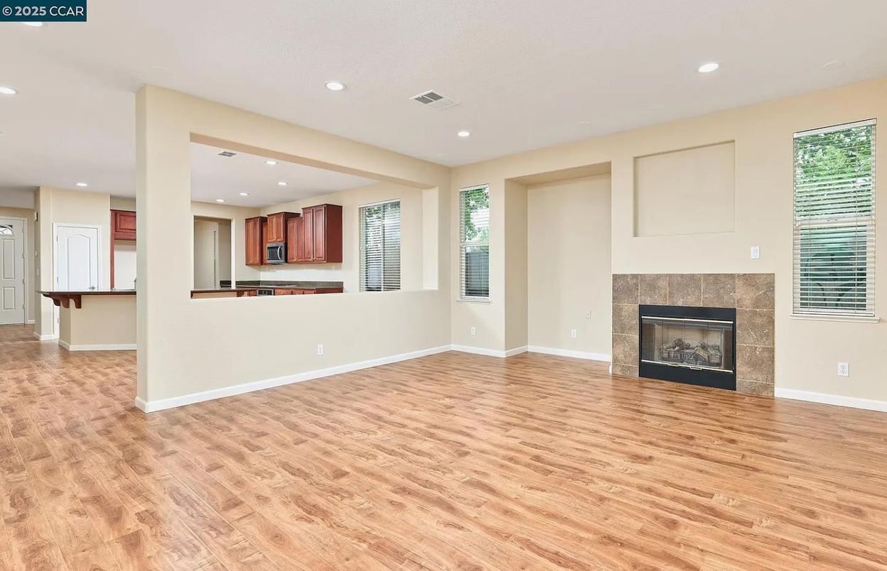 Empty room, Fireplace, Interior, Kitchen, Recessed Lighting, Wood Texture Flooring