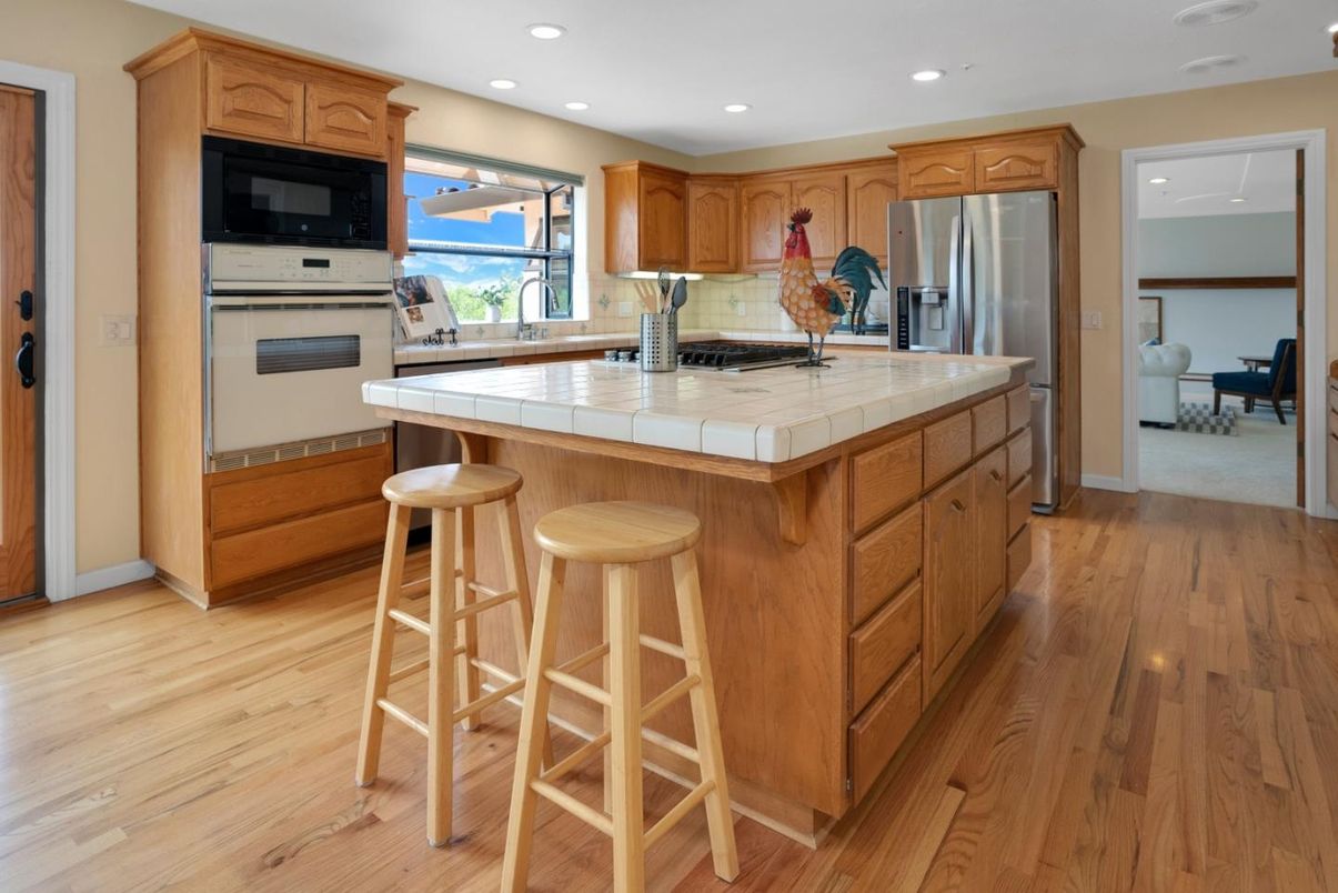 Interior, Kitchen, Recessed Lighting, Stainless Steel Appliances, Tile Countertops, Wood Texture Flooring