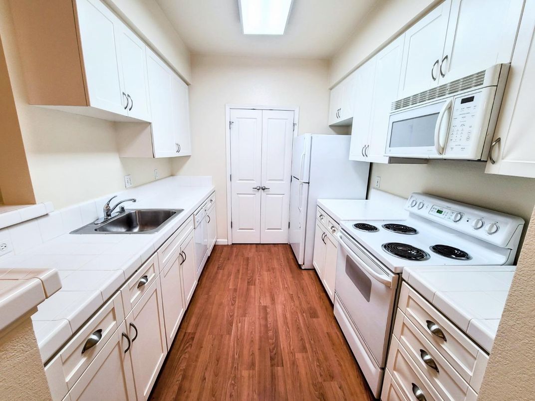 Interior, Kitchen, Tile Countertops, Wood Texture Flooring