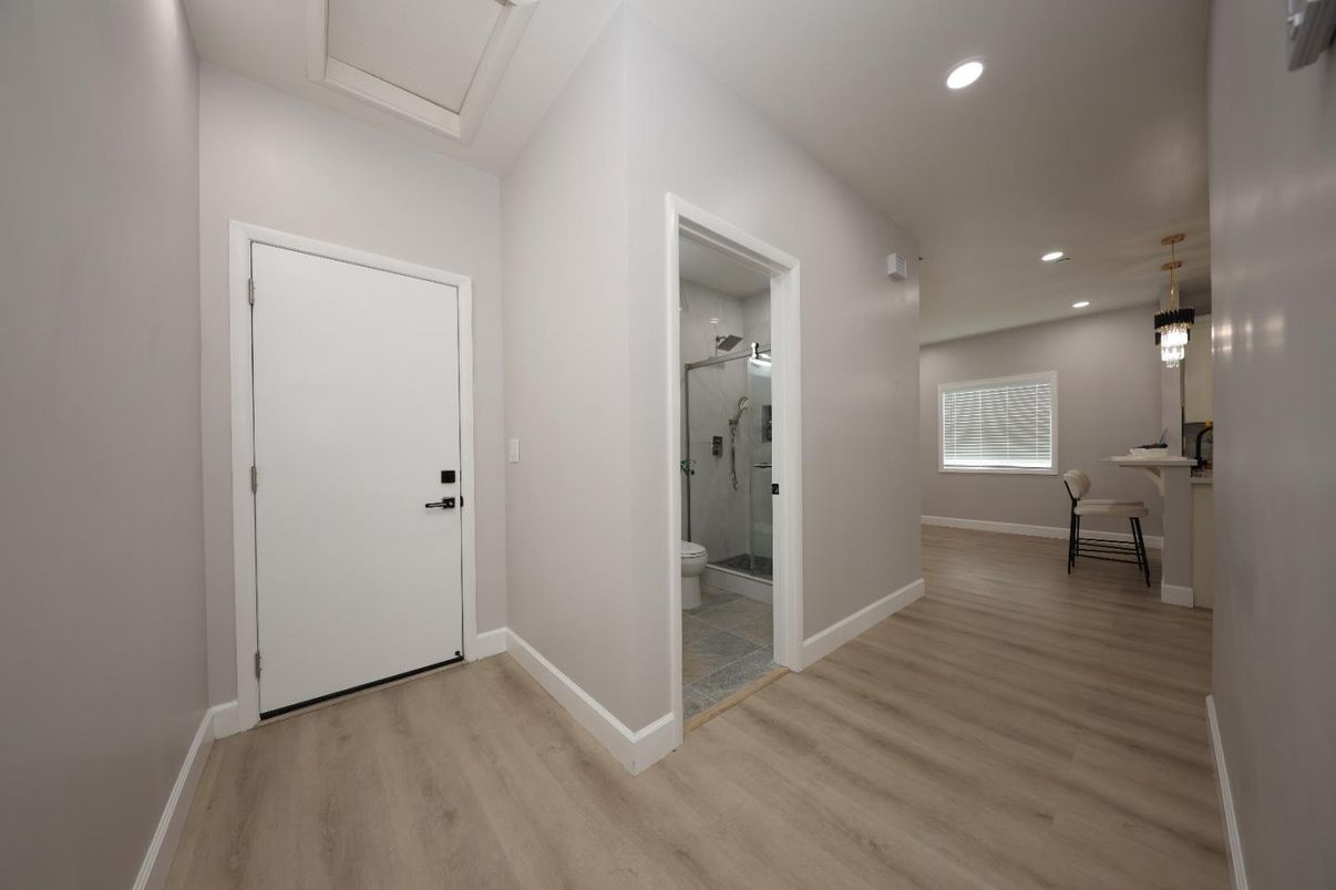 Bathroom, Glass Shower, Interior, Pendant Lights, Recessed Lighting, Wood Texture Flooring