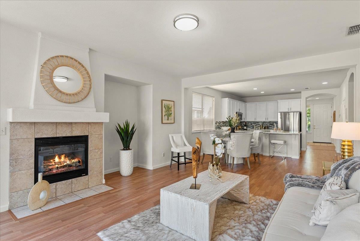 Dining room, Fireplace, Interior, Kitchen, Living room, Recessed Lighting, Stainless Steel Appliances, Wood Texture Flooring