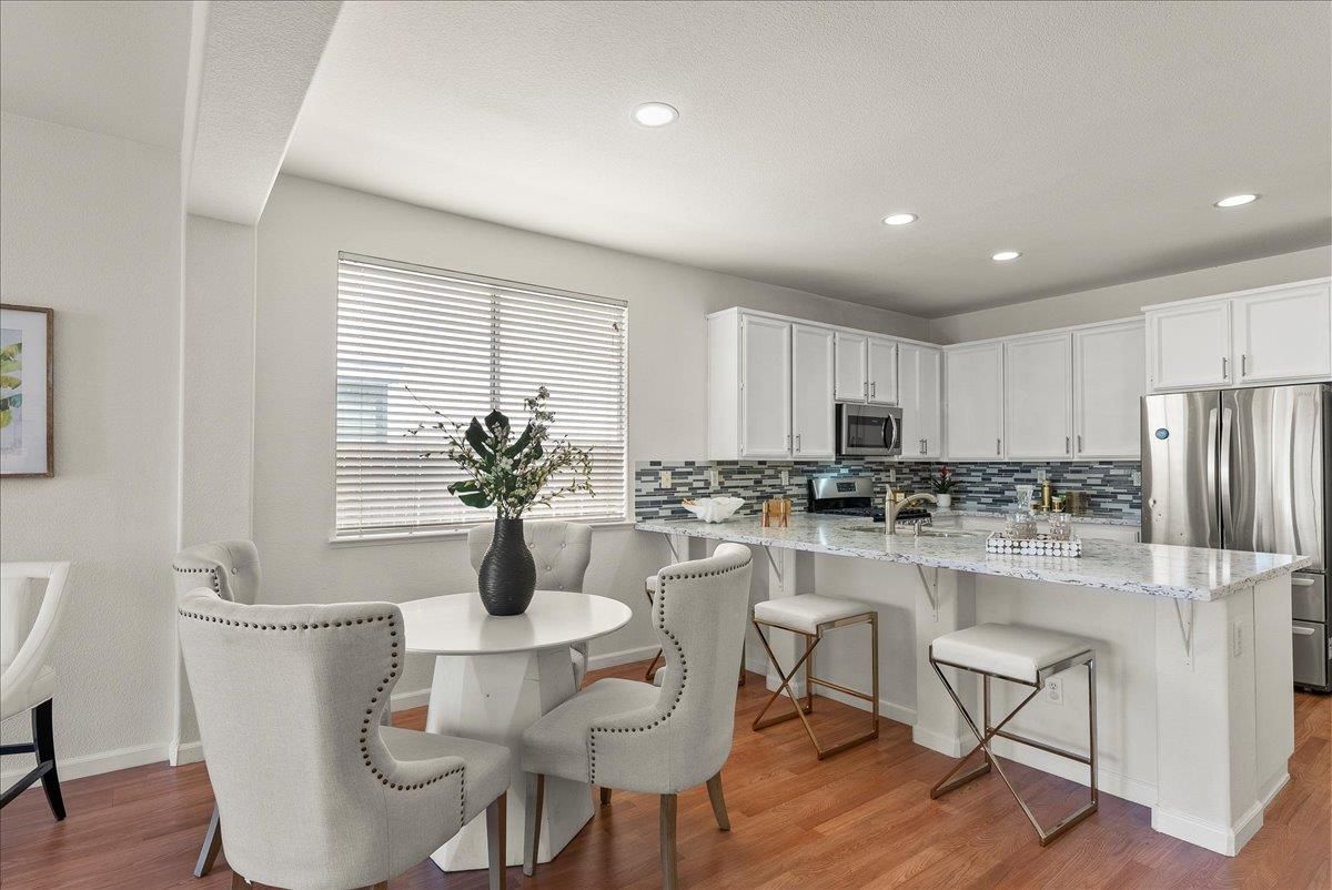 Dining room, Interior, Kitchen, Recessed Lighting, Stainless Steel Appliances, Wood Texture Flooring