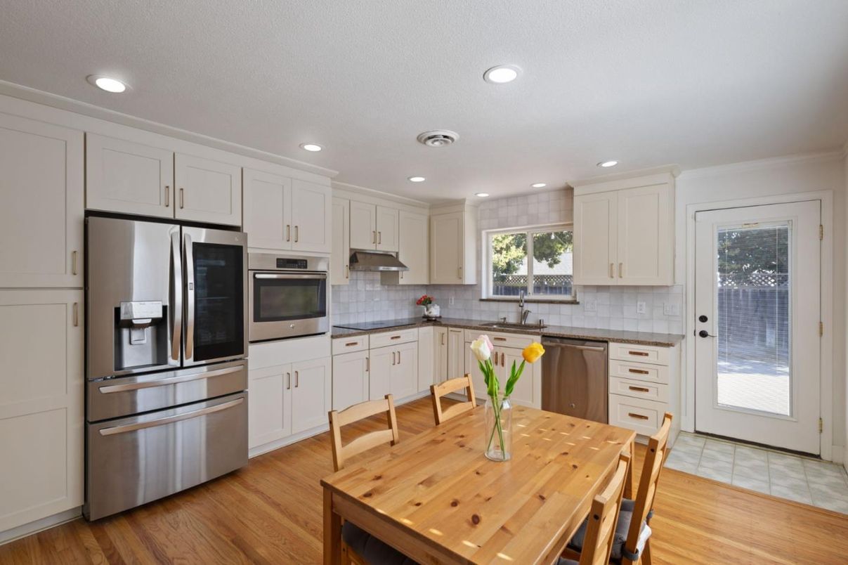 Dining room, Interior, Kitchen, Recessed Lighting, Stainless Steel Appliances, Wood Texture Flooring