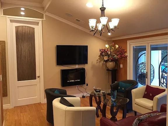 Chandelier, Fireplace, Interior, Living room, Recessed Lighting, Wood Texture Flooring
