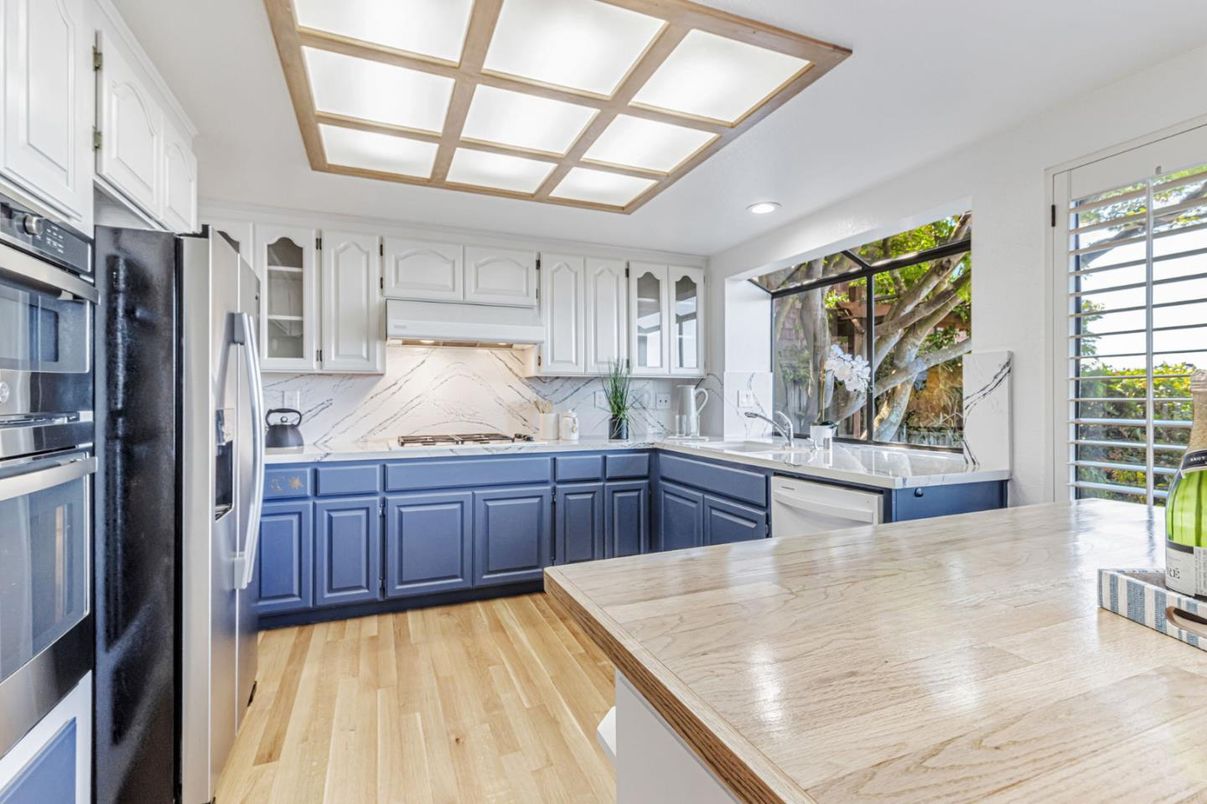 Interior, Kitchen, Marble Walls, Recessed Lighting, Stainless Steel Appliances, Wood Texture Flooring