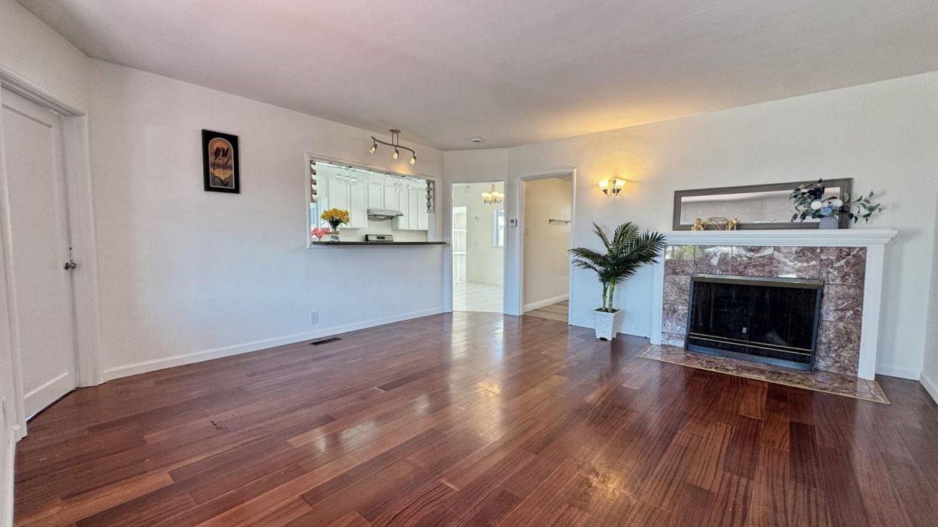 Empty room, Fireplace, Interior, Kitchen, Pendant Lights, Wood Texture Flooring