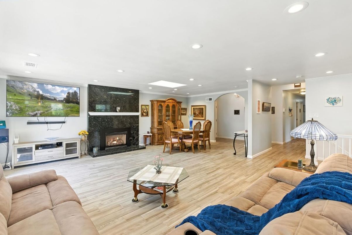 Dining room, Fireplace, Interior, Living room, Recessed Lighting, Wood Texture Flooring