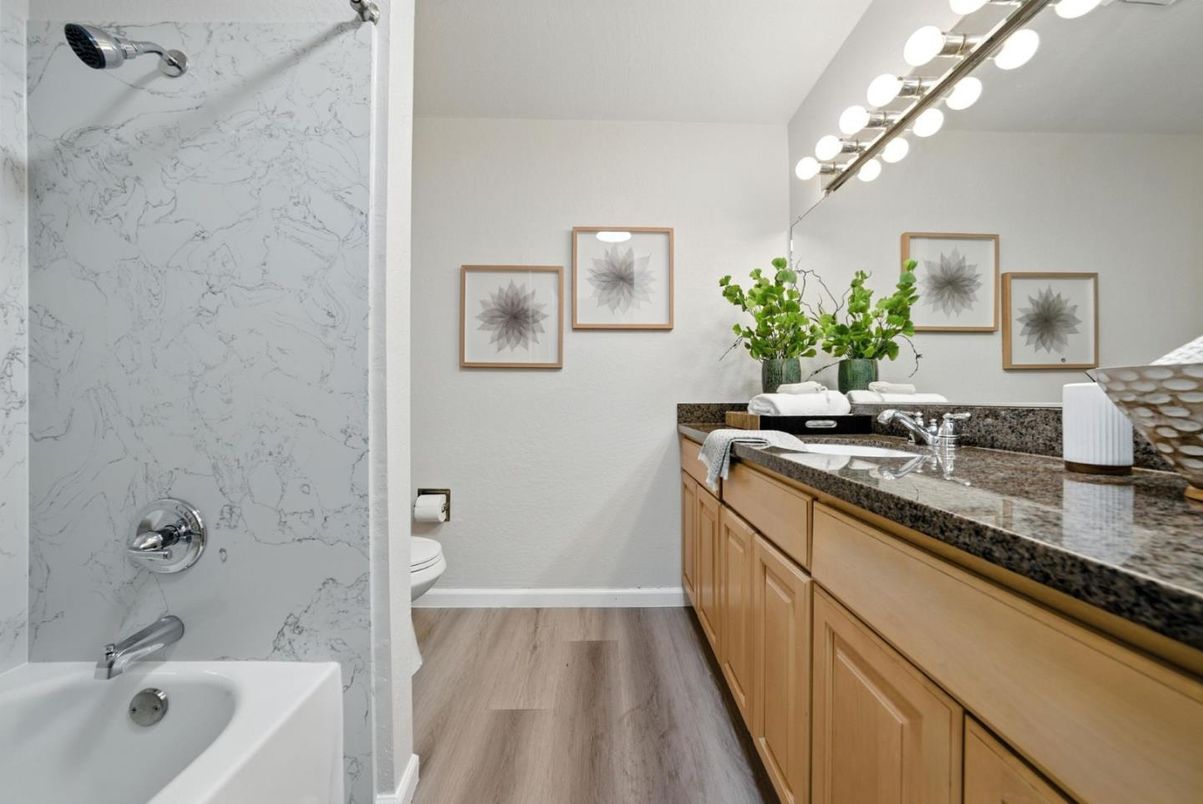 Bathroom, Dual Sink Vanities, Interior, Marble Walls, Wood Texture Flooring