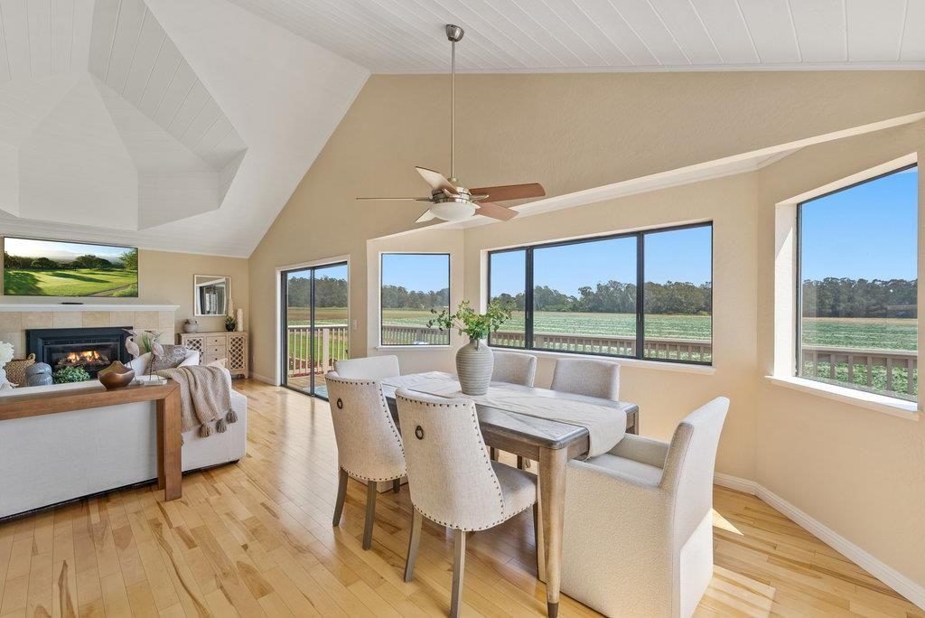 Dining room, Fireplace, Interior, Living room, Pendant Lights, Water, Wood Texture Flooring