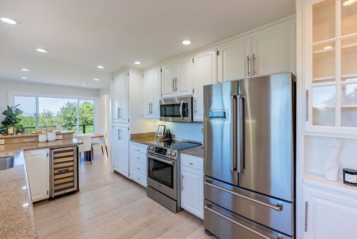 Dining room, Interior, Kitchen, Recessed Lighting, Stainless Steel Appliances, Wood Texture Flooring