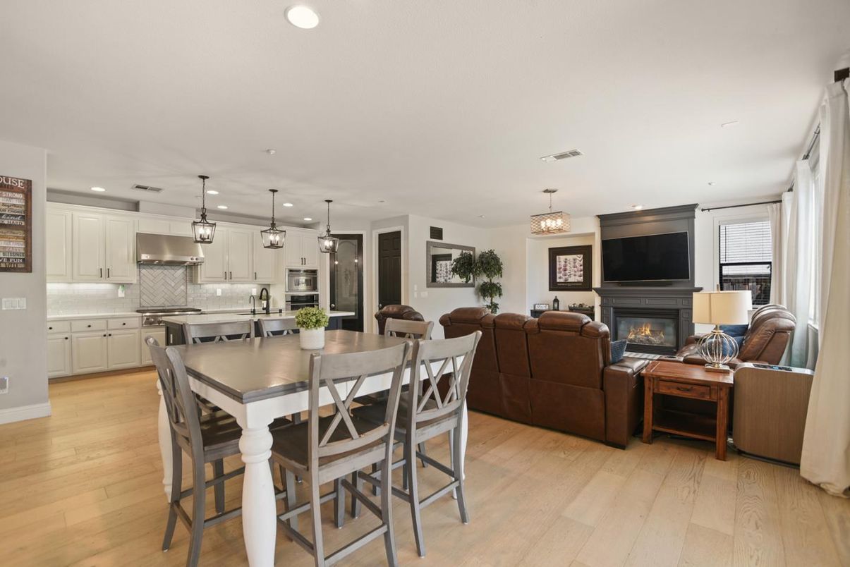 Dining room, Fireplace, Interior, Kitchen, Living room, Pendant Lights, Recessed Lighting, Stainless Steel Appliances, Wood Texture Flooring