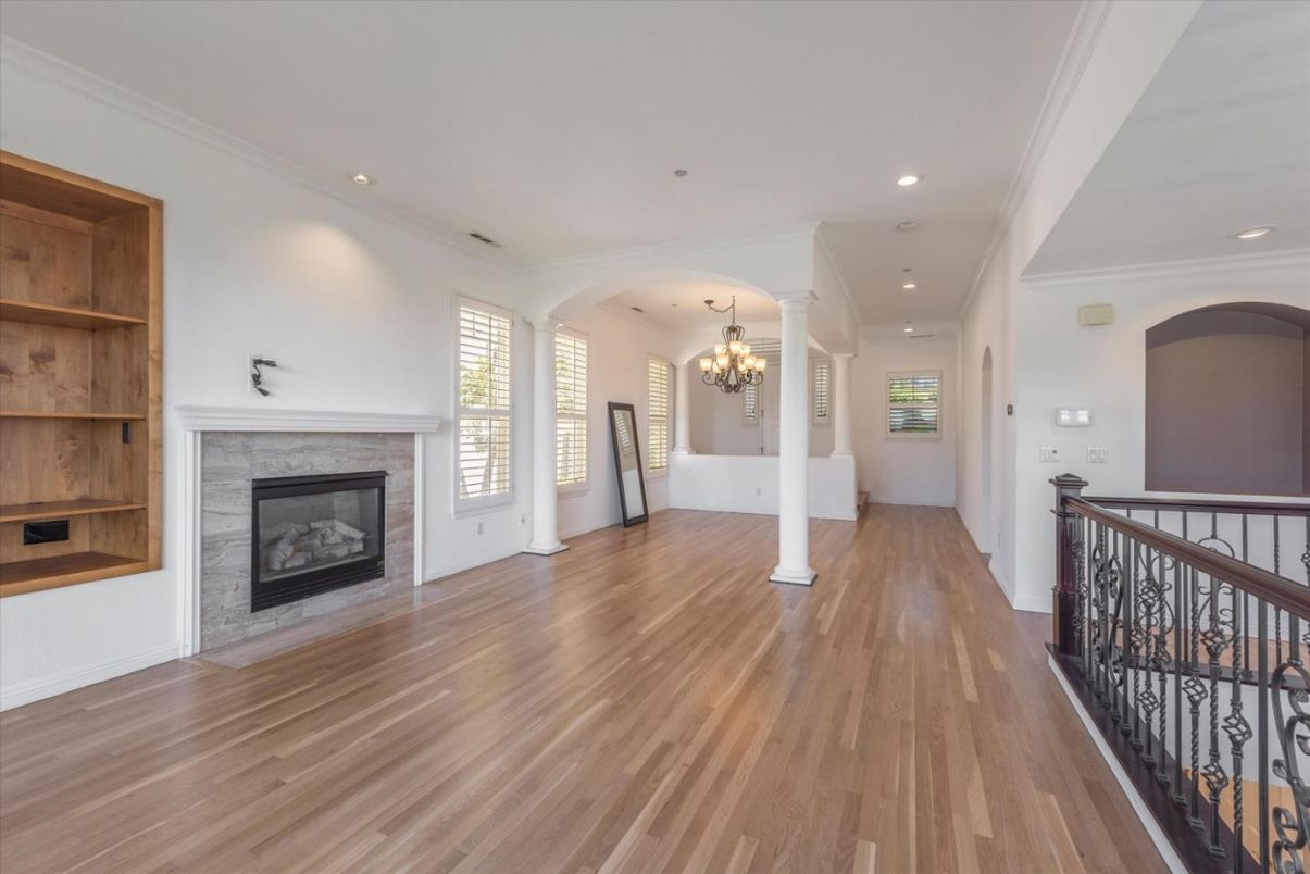 Chandelier, Empty room, Fireplace, Interior, Recessed Lighting, Wood Texture Flooring