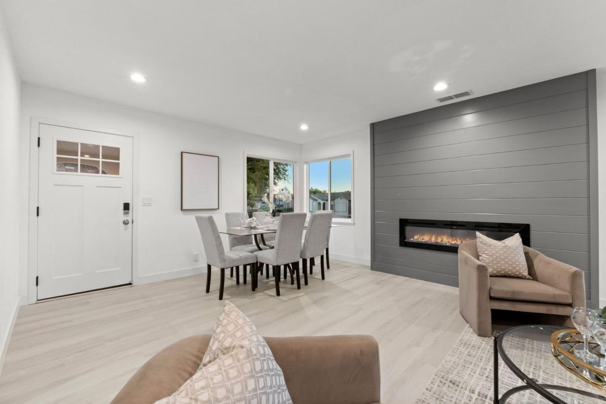Dining room, Fireplace, Interior, Living room, Recessed Lighting, Wood Texture Flooring