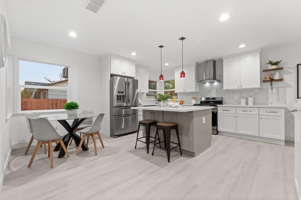 Dining room, Interior, Kitchen, Pendant Lights, Recessed Lighting, Stainless Steel Appliances, Wood Texture Flooring