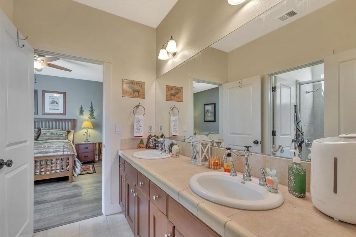 Bathroom, Bedroom, Dual Sink Vanities, Glass Shower, Interior, Tile Countertops, Wood Texture Flooring