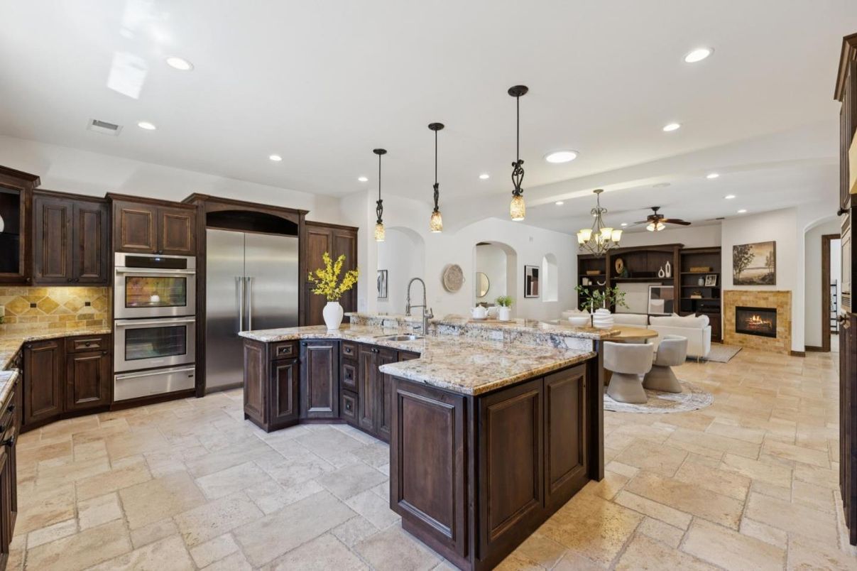 Chandelier, Dining room, Fireplace, Interior, Kitchen, Living room, Pendant Lights, Recessed Lighting, Stainless Steel Appliances
