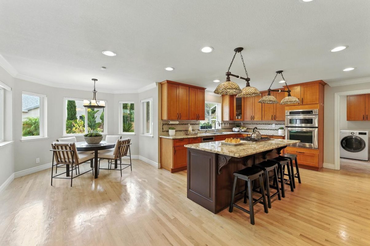 Dining room, Interior, Kitchen, Pendant Lights, Recessed Lighting, Stainless Steel Appliances, Wood Texture Flooring