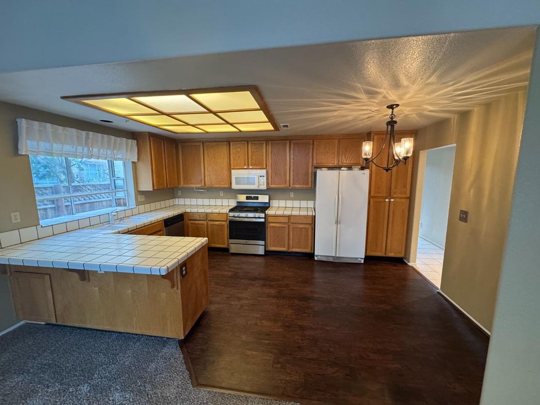Chandelier, Interior, Kitchen, Pendant Lights, Tile Countertops, Wood Texture Flooring