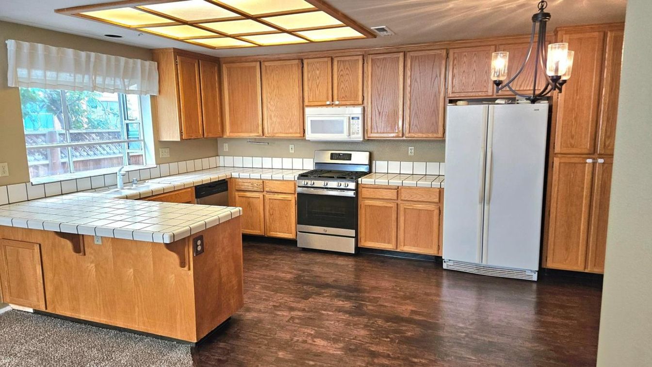 Interior, Kitchen, Pendant Lights, Tile Countertops, Wood Texture Flooring