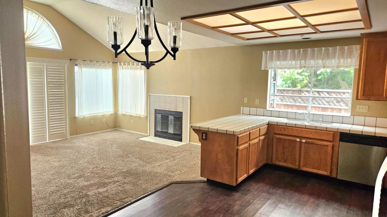Fireplace, Interior, Kitchen, Pendant Lights, Tile Countertops, Wood Texture Flooring