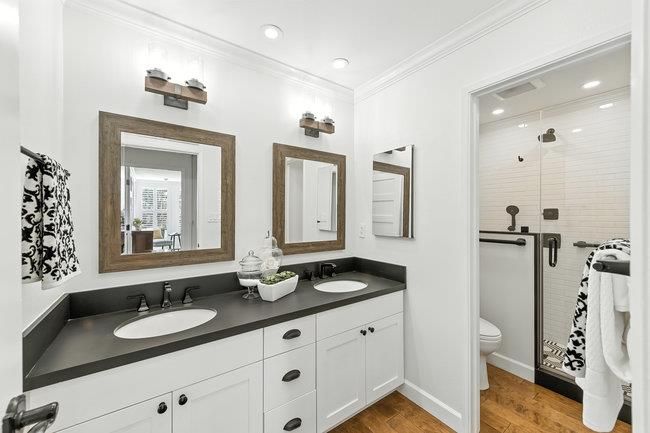 Bathroom, Dual Sink Vanities, Glass Shower, Interior, Recessed Lighting, Wood Texture Flooring