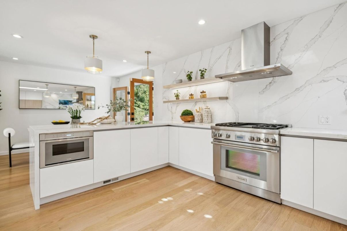Interior, Kitchen, Marble Walls, Pendant Lights, Recessed Lighting, Stainless Steel Appliances, Wood Texture Flooring