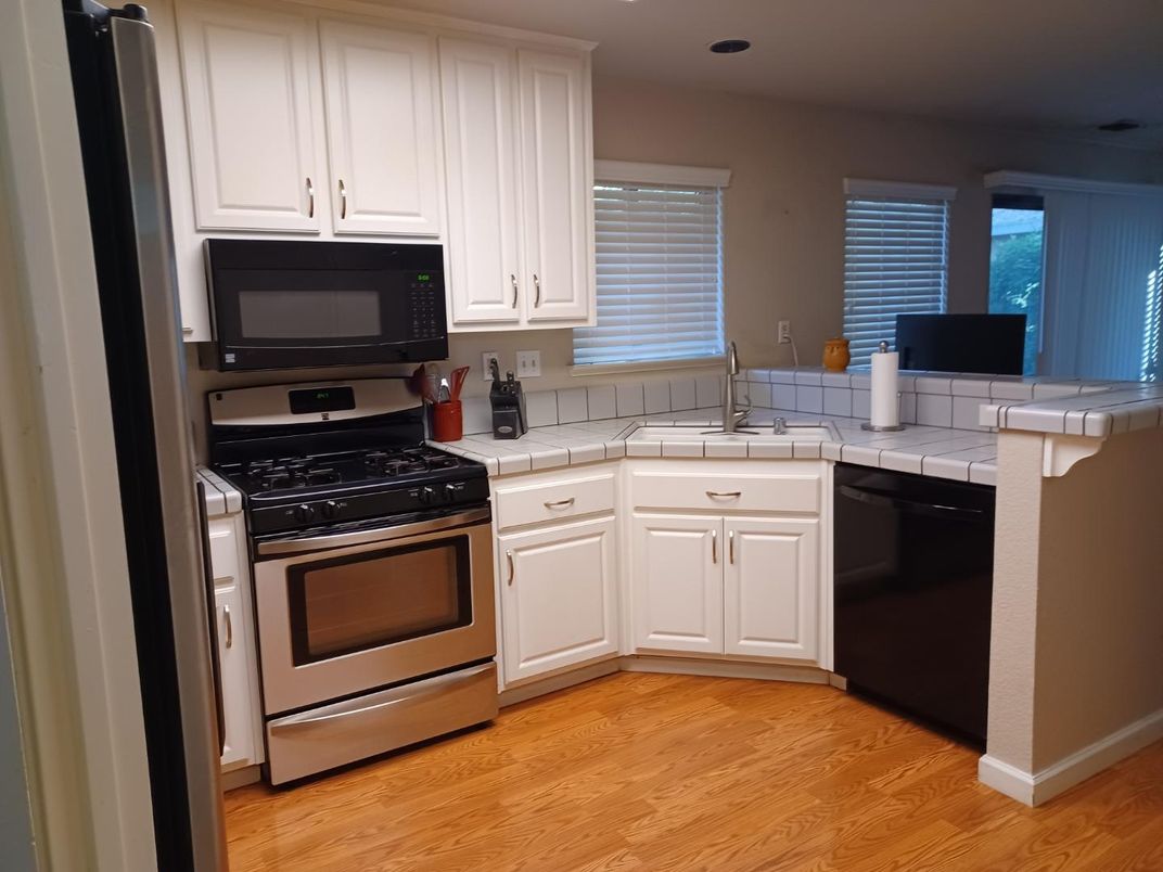 Interior, Kitchen, Recessed Lighting, Tile Countertops, Wood Texture Flooring