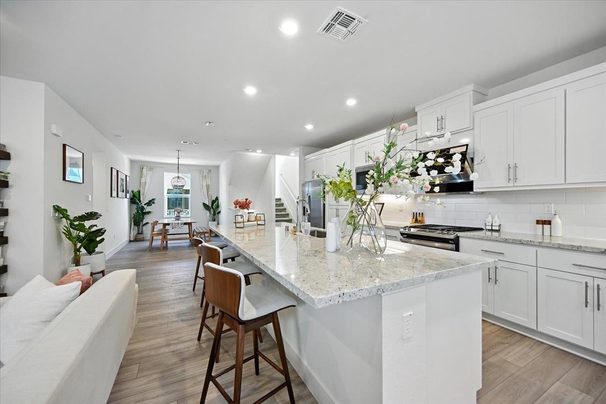 Dining room, Interior, Kitchen, Pendant Lights, Recessed Lighting, Stainless Steel Appliances, Wood Texture Flooring