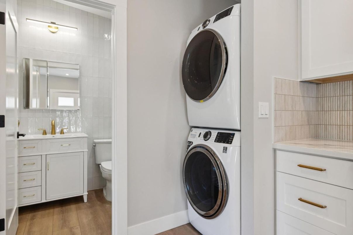 Bathroom, Interior, Tile Countertops, Utility Closets, Washer, Wood Texture Flooring