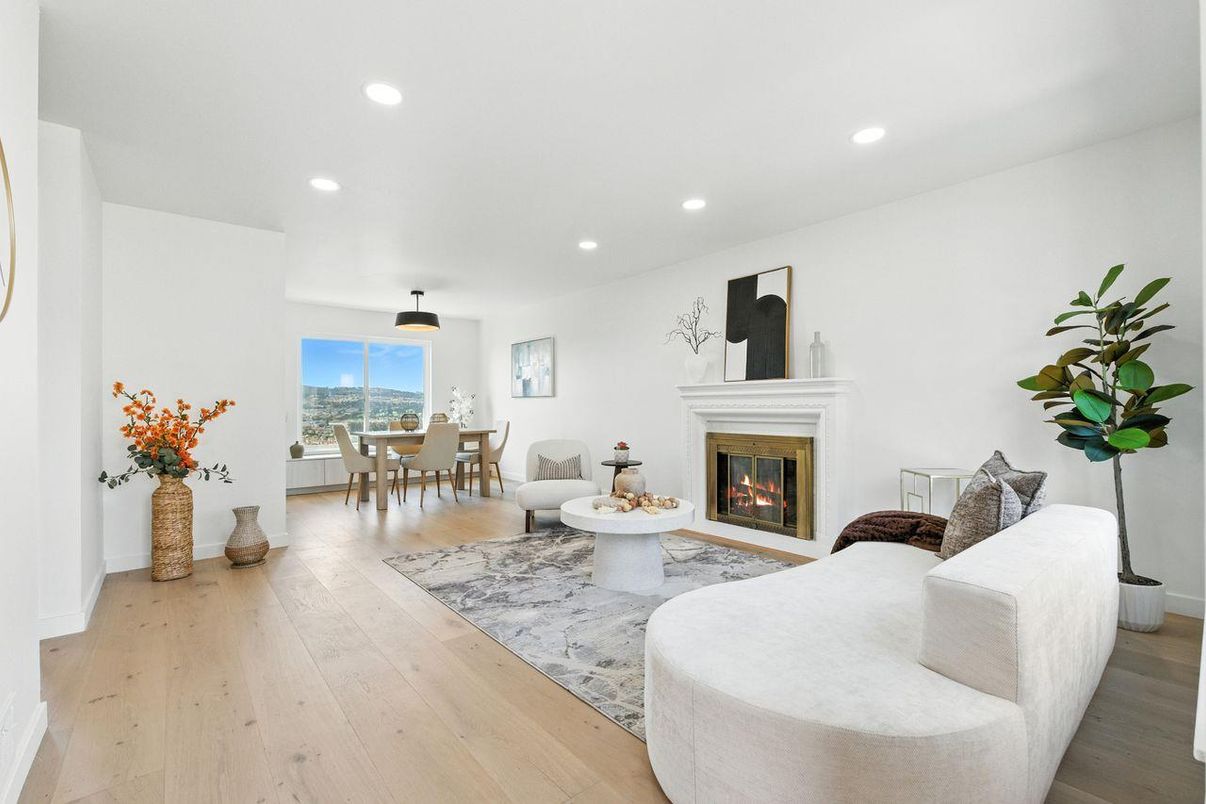 Dining room, Fireplace, Interior, Living room, Recessed Lighting, Wood Texture Flooring