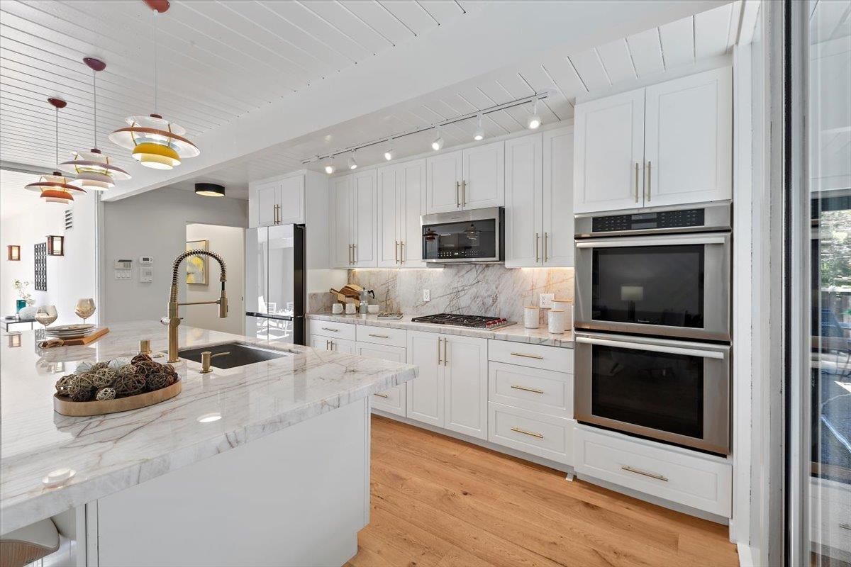 Interior, Kitchen, Marble Walls, Pendant Lights, Stainless Steel Appliances, Wood Texture Flooring