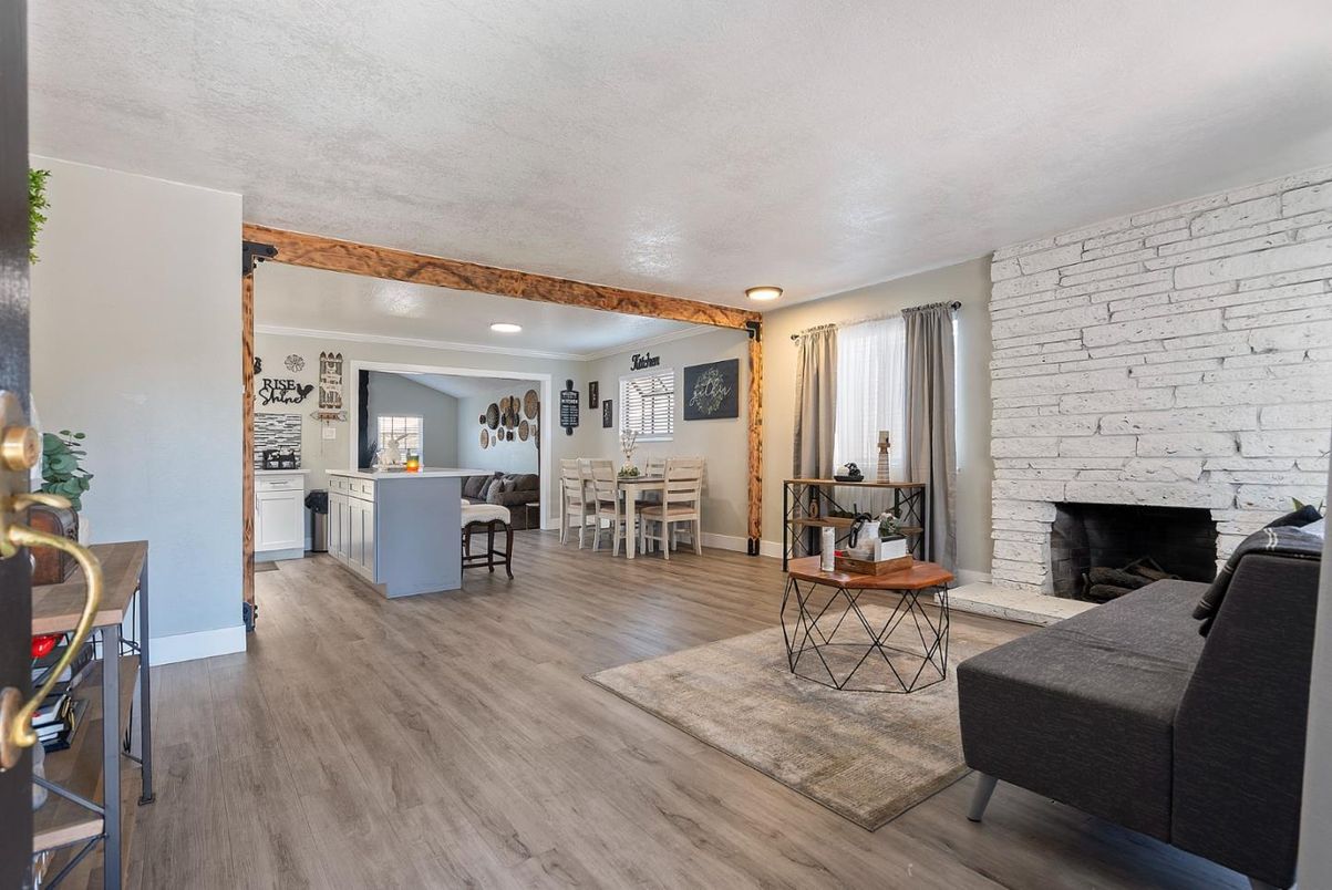 Dining room, Fireplace, Interior, Living room, Recessed Lighting, Stone Walls, Wooden Beams, Wood Texture Flooring