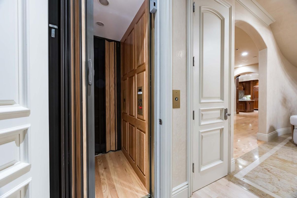 Elevator, Interior, Recessed Lighting, Wood Texture Flooring, Wooden Walls