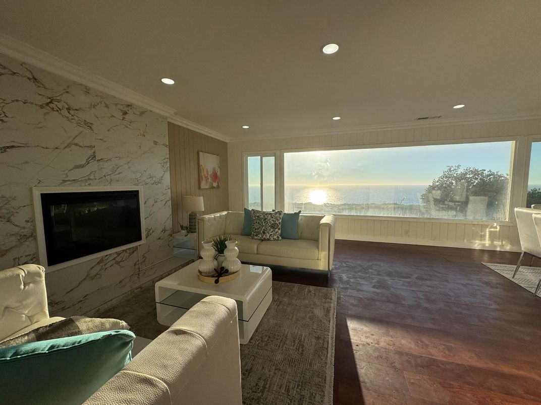 Fireplace, Interior, Living room, Marble Walls, Recessed Lighting, Water, Wood Texture Flooring