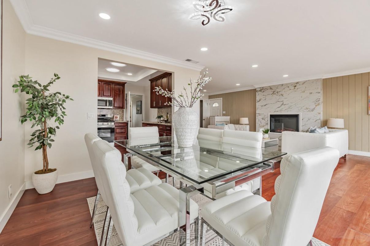 Dining room, Fireplace, Interior, Kitchen, Living room, Recessed Lighting, Stainless Steel Appliances, Wood Texture Flooring