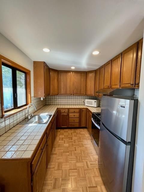 Interior, Kitchen, Recessed Lighting, Tile Countertops, Wood Texture Flooring