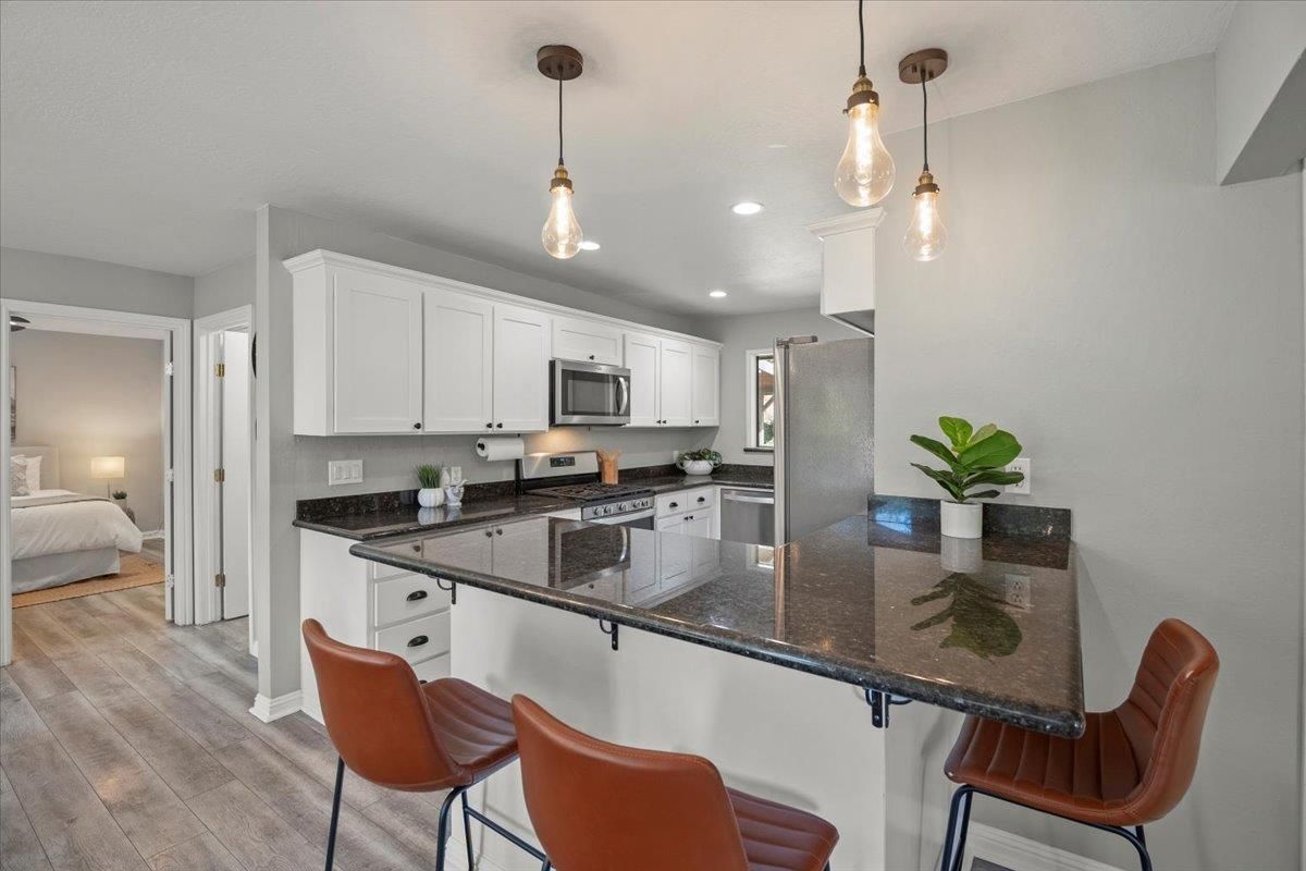 Bedroom, Interior, Kitchen, Pendant Lights, Recessed Lighting, Stainless Steel Appliances, Wood Texture Flooring