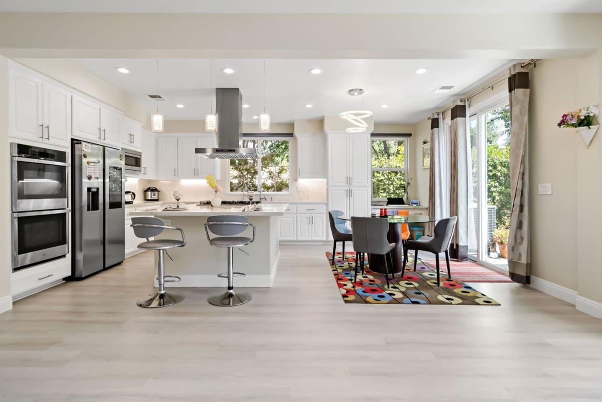 Dining room, Interior, Kitchen, Pendant Lights, Recessed Lighting, Stainless Steel Appliances, Wood Texture Flooring