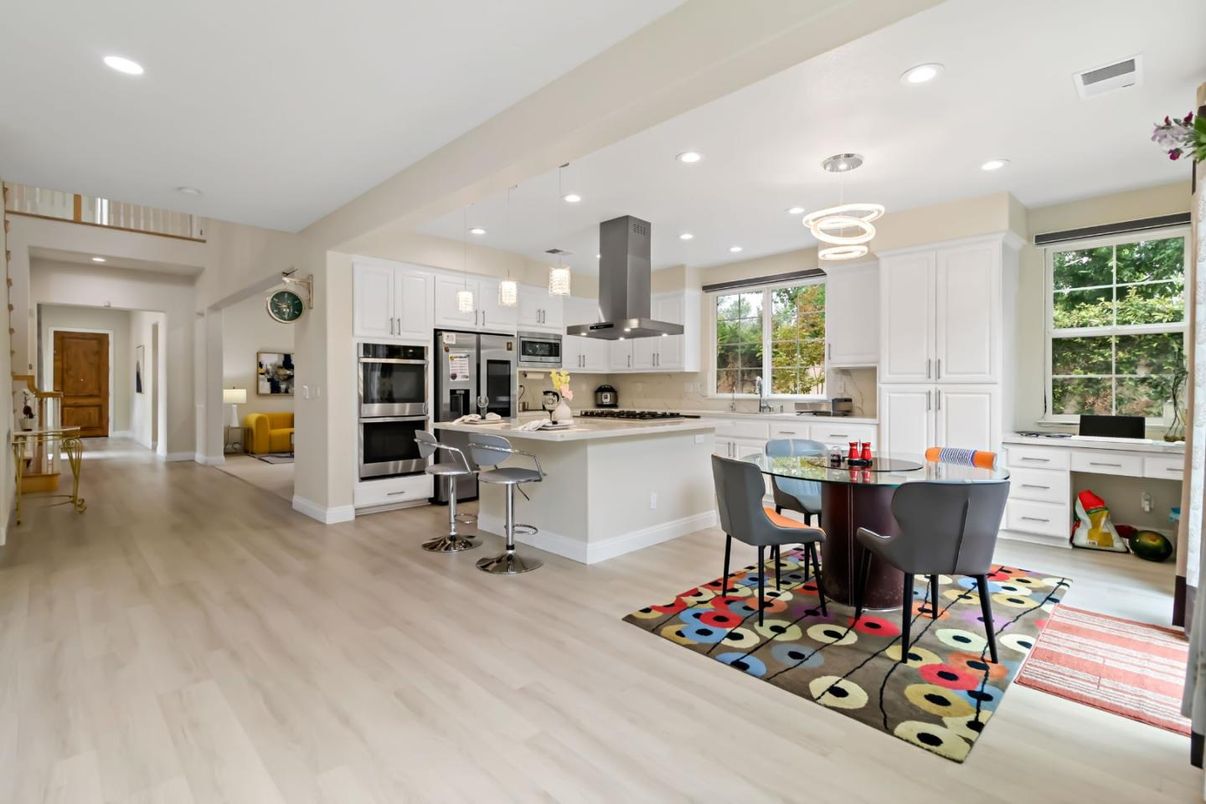 Dining room, Interior, Kitchen, Pendant Lights, Recessed Lighting, Stainless Steel Appliances, Wood Texture Flooring