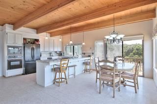 Chandelier, Dining room, Interior, Kitchen, Pendant Lights, Stainless Steel Appliances, Wooden Beams, Wooden Ceilings