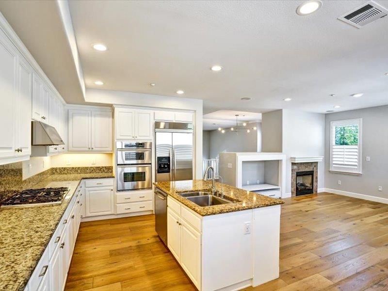 Fireplace, Interior, Kitchen, Pendant Lights, Recessed Lighting, Stainless Steel Appliances, Wood Texture Flooring