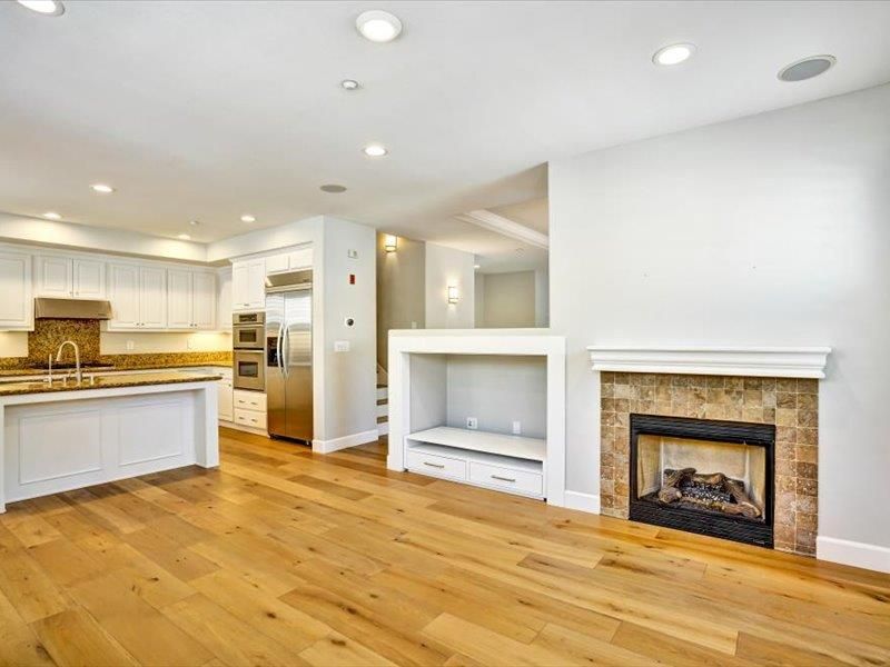 Fireplace, Interior, Kitchen, Recessed Lighting, Stainless Steel Appliances, Wood Texture Flooring