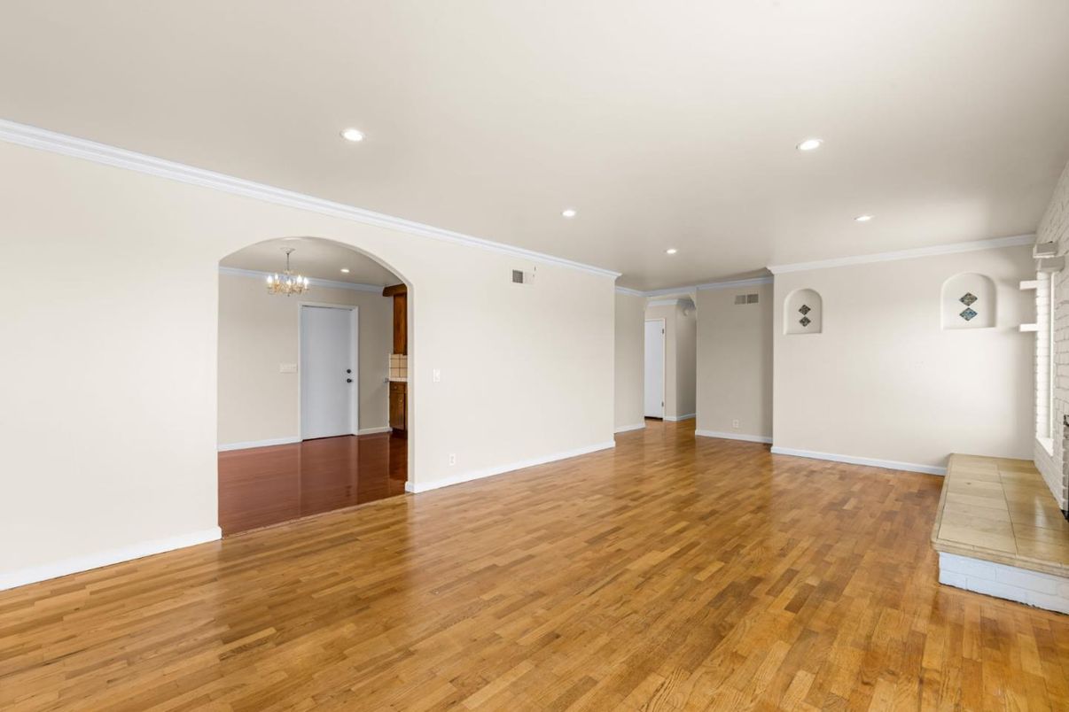 Chandelier, Empty room, Fireplace, Interior, Recessed Lighting, Wood Texture Flooring