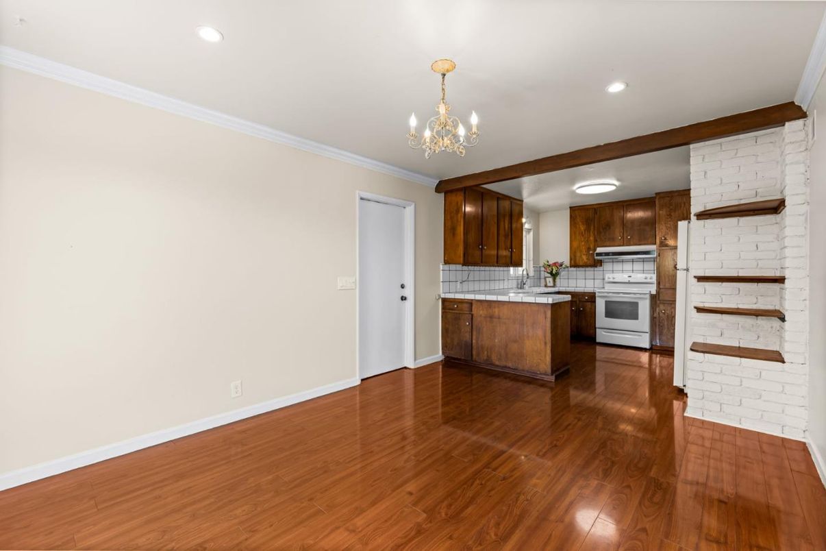 Interior, Kitchen, Recessed Lighting, Tile Countertops, Wood Texture Flooring