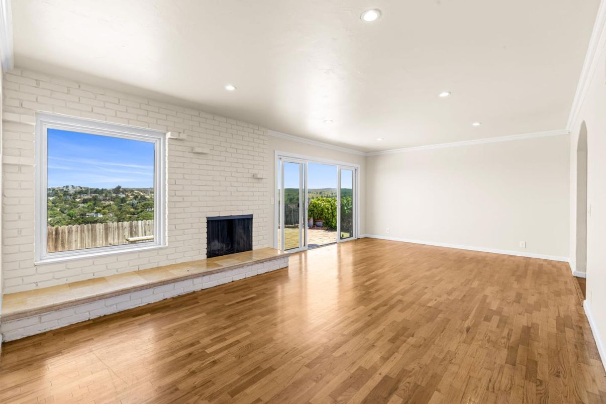 Empty room, Fireplace, Interior, Recessed Lighting, Stone Walls, Wood Texture Flooring