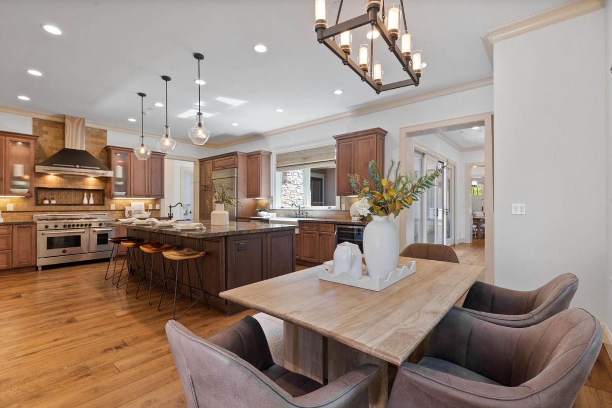 Chandelier, Dining room, Interior, Kitchen, Pendant Lights, Recessed Lighting, Stainless Steel Appliances, Wood Texture Flooring