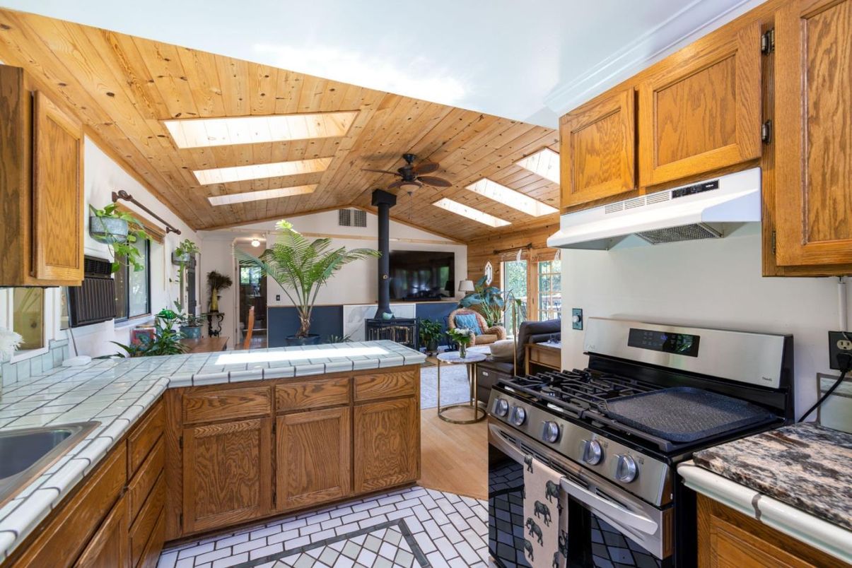 Fireplace, Interior, Kitchen, Tile Countertops, Wooden Ceilings, Wood Texture Flooring